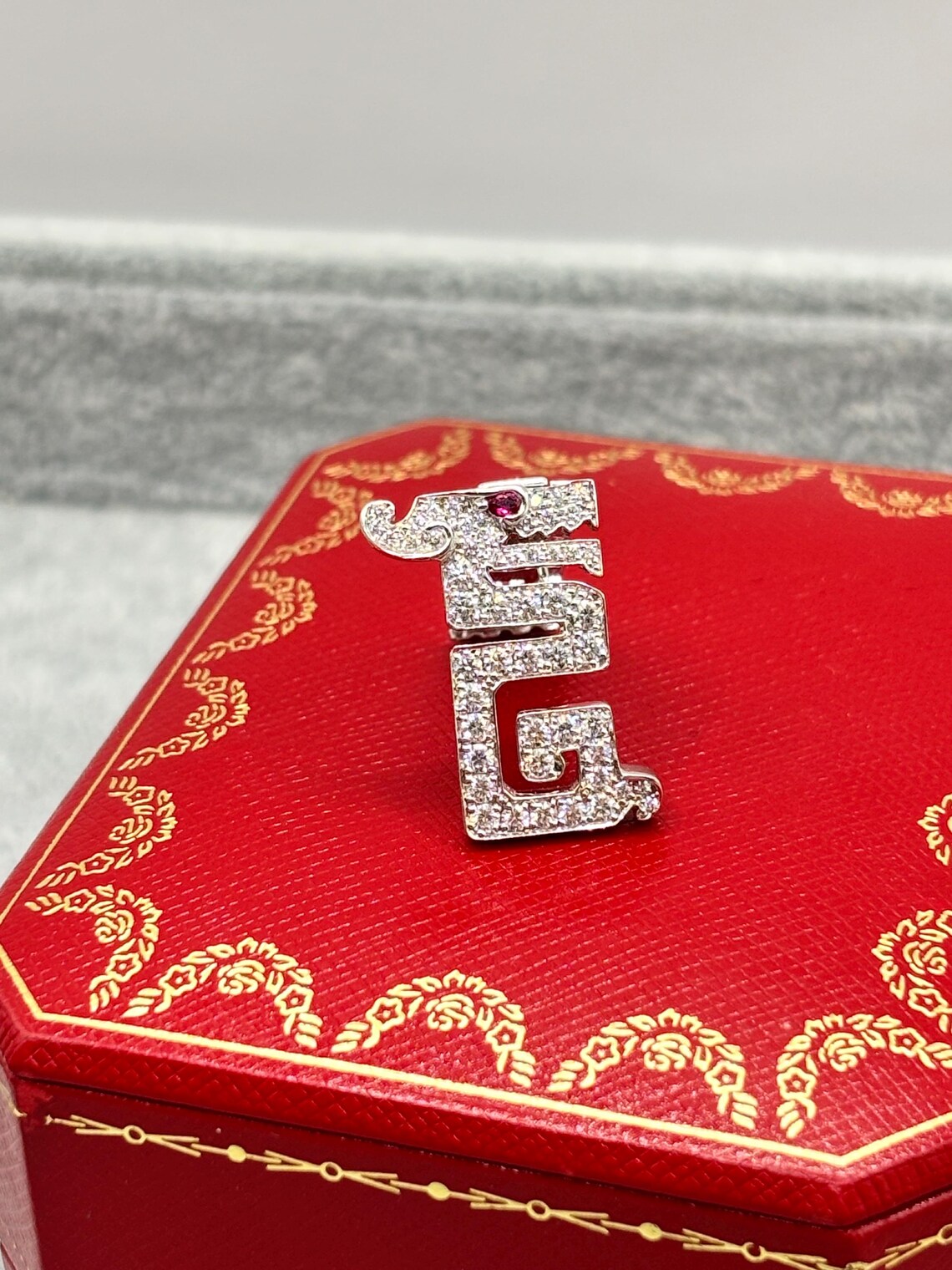 Cartier “Le Baiser du Dragon” Diamond & Ruby Pin Brooch, 18K White Gold, Signed & Numbered, Cartier Case, 1990s